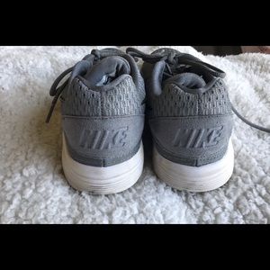 A gray pair of Nike Sneakers